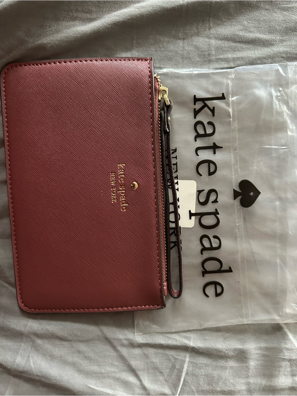 kate spade Rose Pink Leather Wristlet with Gold Logo
